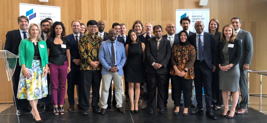 Investment Leadership Network organization members congratulating 13 new graduates of the sustainable infrastructure program.