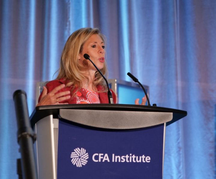 Portrait of Oona Stock, speaking at a podium